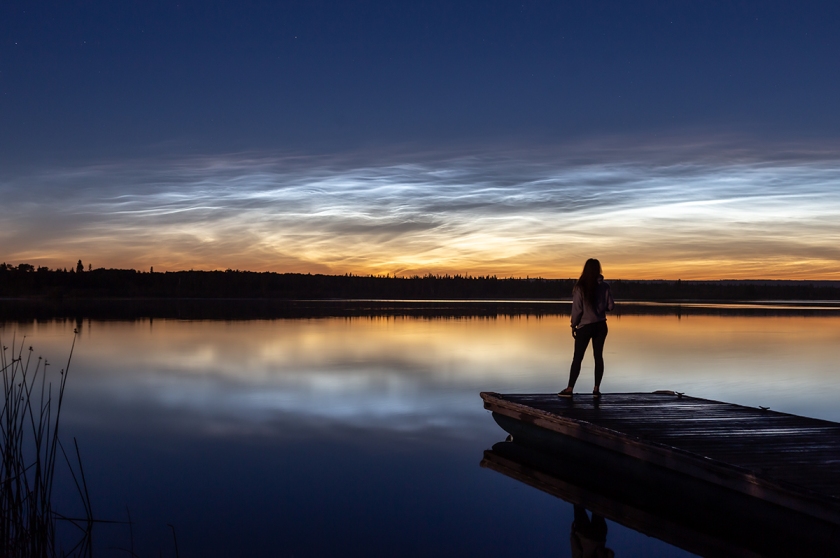 Glowing white noctilucent clouds self portrait